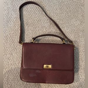 J Crew 100% leather hand bag. Wine color. Minor wear. Removable strap
